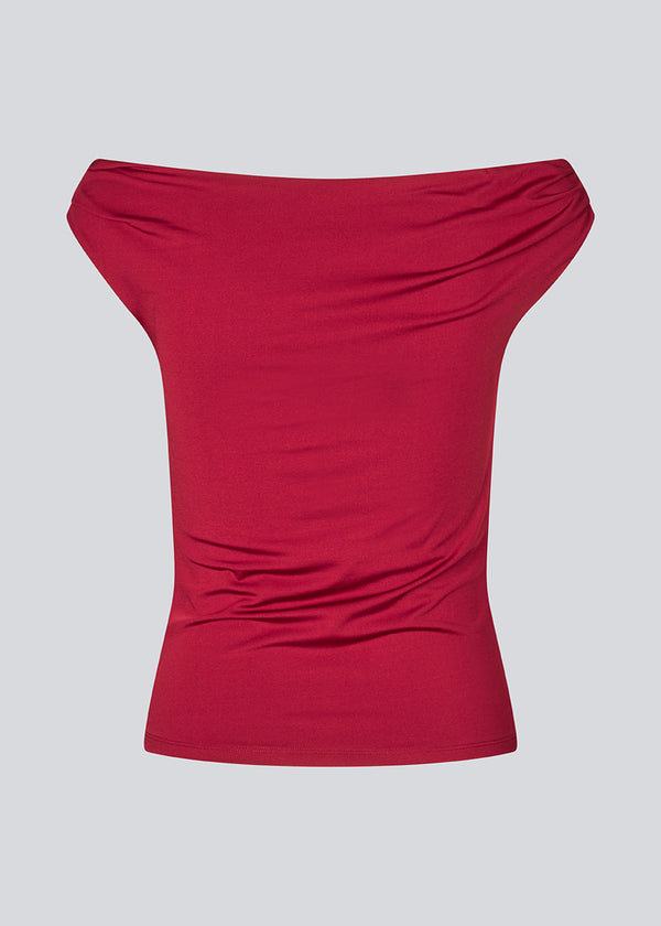 Off-shoulder top in a stretchy material. HimaMD off-shoulder top is fitted and slightly cropped.