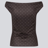 Off-shoulder top in dark brown with white small dots in a stretchy material. HimaMD off-shoulder top is fitted and slightly cropped.&nbsp;