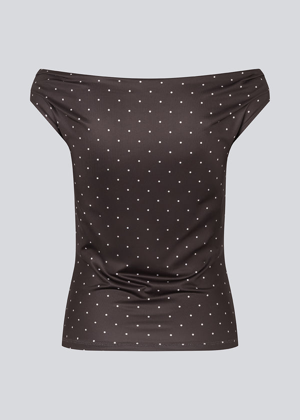 Off-shoulder top in dark brown with white small dots in a stretchy material. HimaMD off-shoulder top is fitted and slightly cropped.&nbsp;