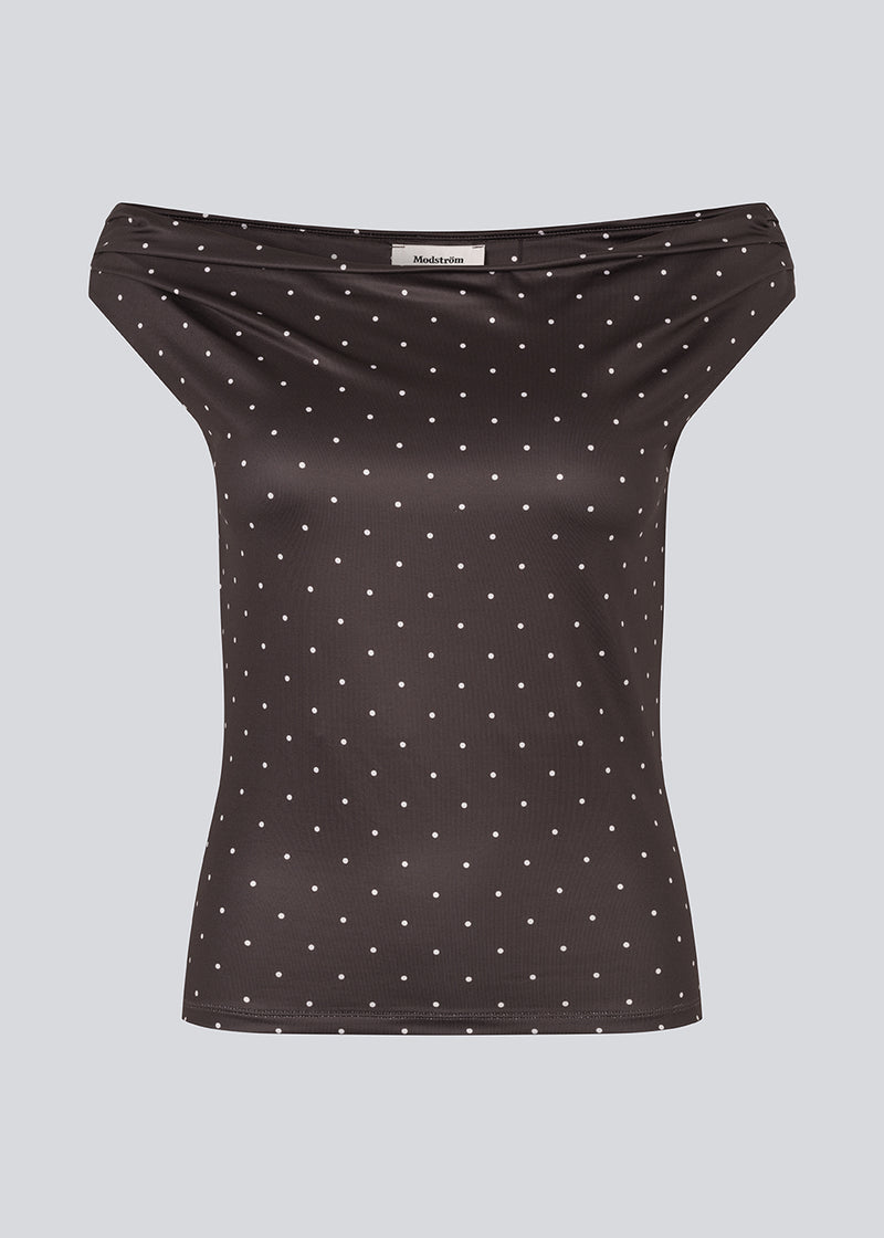 Off-shoulder top in dark brown with white small dots in a stretchy material. HimaMD off-shoulder top is fitted and slightly cropped.&nbsp;