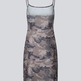 Modern printed strap dress. HimaMD print strap dress is a versatile design featuring a cool camouflage print, slim straps, and a clean, straight silhouette. It can be styled on its own or layered over trousers for a cool, fashion-forward look.