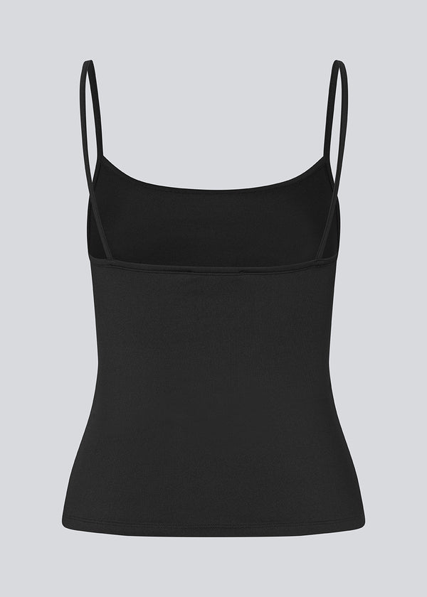 Fitted top in black in recycled polyester. Himamd strap top has a round neck and thin straps.