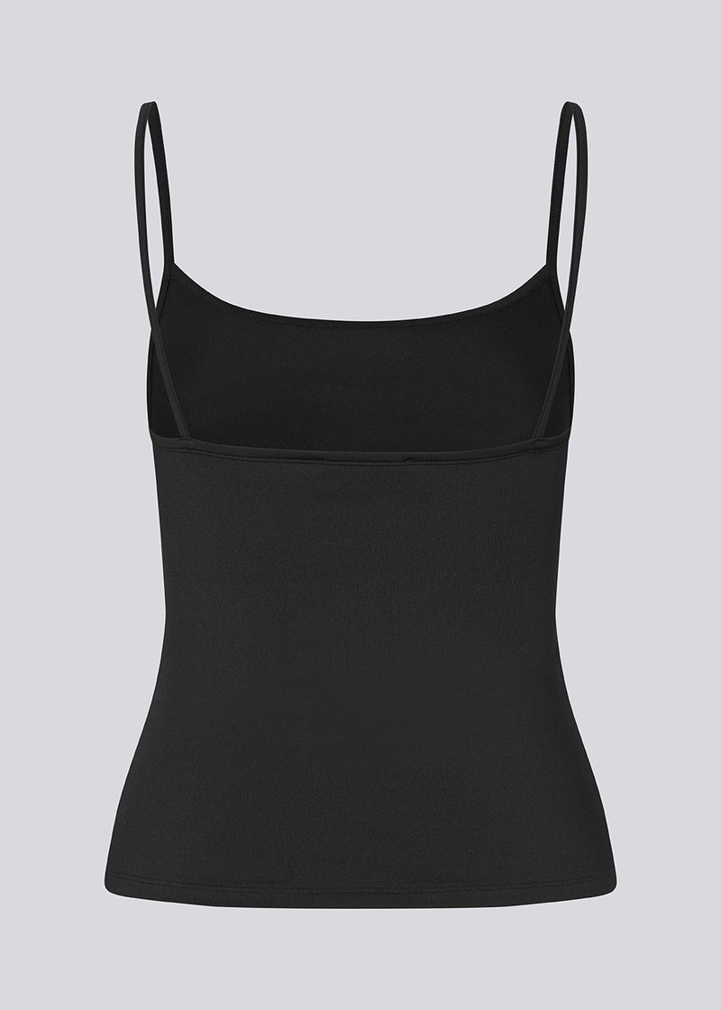 Fitted top in black in recycled polyester. Himamd strap top has a round neck and thin straps.