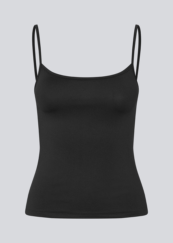 Fitted top in black in recycled polyester. Himamd strap top has a round neck and thin straps.