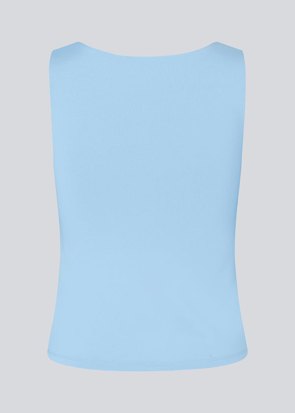 Top in baby blue with wide straps and stretch in recycled quality. HimaMD top has tight-fitted silhouette with chest reinforcement.