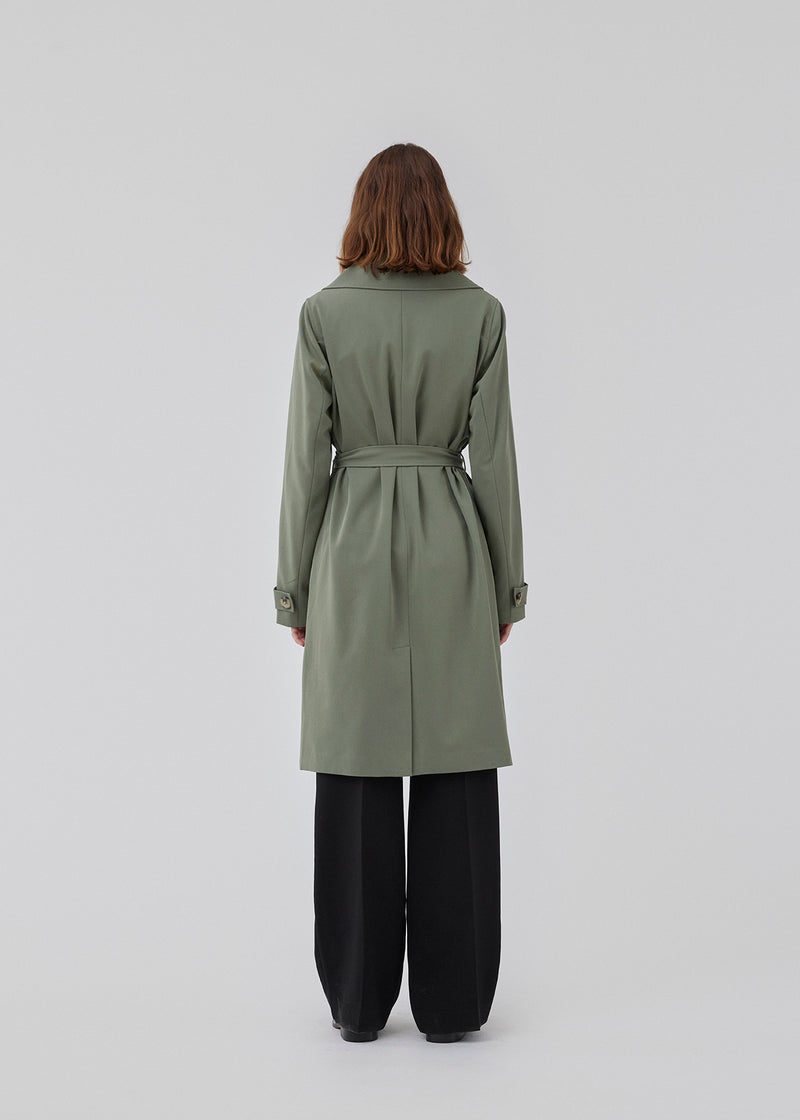 Beautiful jacket in light green with a classic look and wide revers, belted waist and button closure. Hiro jacket is the perfect transition jacket. This jacket has a spacious fit. We recommend sizing down. The model is 174 cm and wears a size S/36