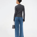 Dark grey fitted cardigan made from a soft, rib-knitted wool. HirokiMD cardigan has a collar, buttons in front, and long sleeves with slit and buttons. The model is 175 cm and wears a size S/36.