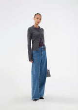 Dark grey fitted cardigan made from a soft, rib-knitted wool. HirokiMD cardigan has a collar, buttons in front, and long sleeves with slit and buttons. The model is 175 cm and wears a size S/36.