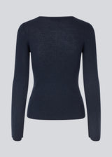 Fitted top made in a soft, rib-knitted wool. HirokiMD o-neck has long flared sleeves. 