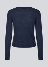 Fitted cardigan in soft knit. HirokiMD short cardigan has a round neck and a button closure in front.