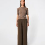Fitted cardigan in soft knit. HirokiMD short cardigan has a round neck and a button closure in front. 