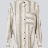 Oversize shirt with collar and button closure in front. HissaMD print shirt has wide sleeves with cuff, and a detailed yoke at the back. 