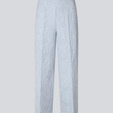 Pants in a light blue color with straight legs in a structured material. HollisMD pants have a medium waist with a hidden zipper at one side, and two welt pockets on the back.