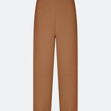 Pants with straight legs in a structured material. HollisMD pants have a medium waist with hidden zipper at one side, and two welt pockets on the back.