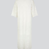 Broderie anglaise cotton dress in white with a casual fit and wide sleeves cutting at the elbow, and a opening in front with a tieband. HollynMD dress is lined. The model is 175 cm and wears a size S/36.