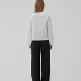 Broderie anglaise cotton shirt in white with three tiebands in front. HollynMD shirt has a normal fit and long wide. sleeves with a tieband at the end. The model is 176 cm and is wearing size S/36.