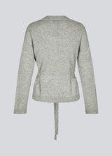 Loose knitted cardigan in 100% mercerized wool. HowieMD cardigan has a tie band in the waist and long loose sleeves.
