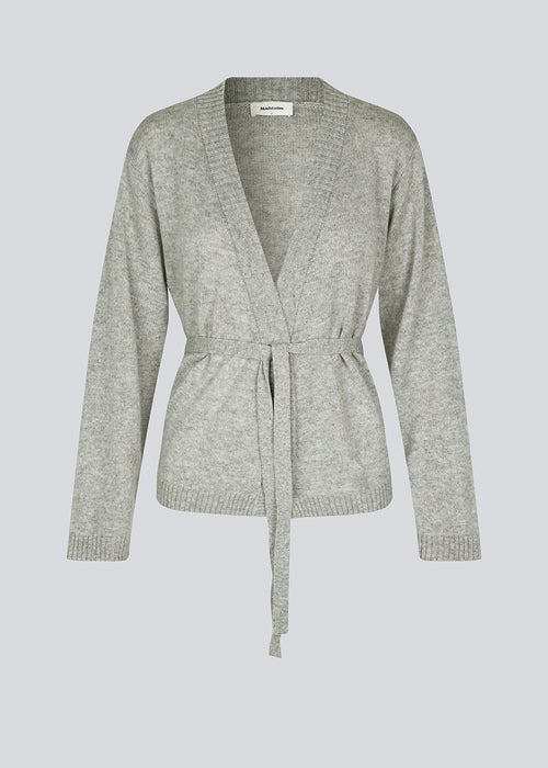 Loose knitted cardigan in 100% mercerized wool. HowieMD cardigan has a tie band in the waist and long loose sleeves.

