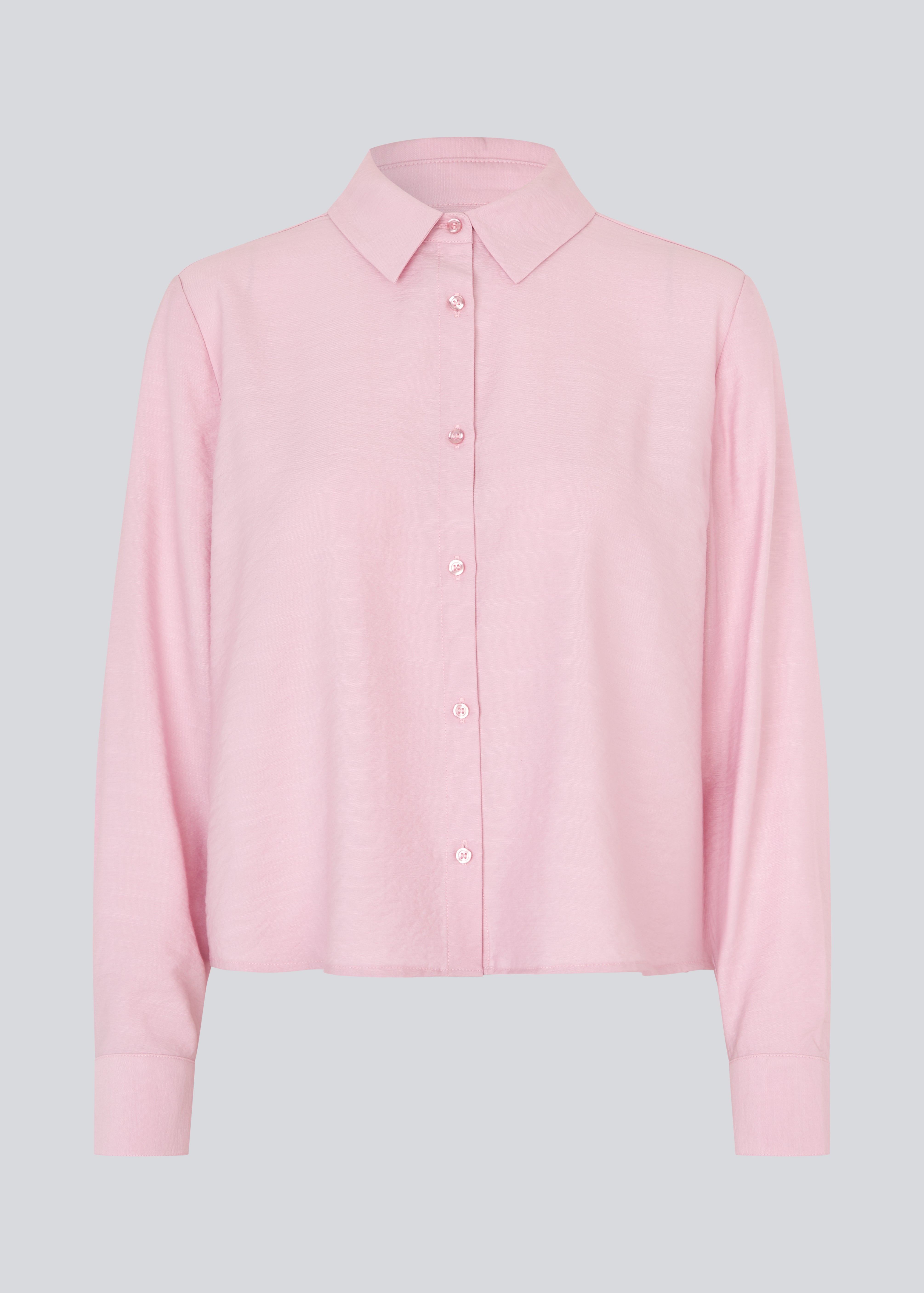 Shirt in light pink/rosa in a light EcoVero viscose with a loose fit. HudgesMD shirt has a collar, button closure in front, and long sleeves with cuffs.&nbsp;