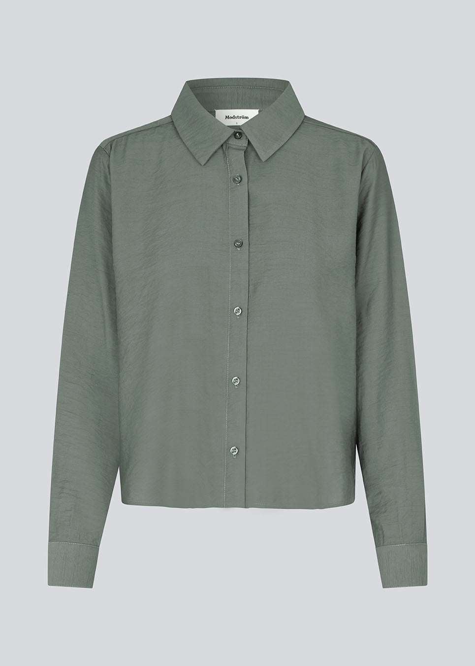 Shirt in soft green in a light EcoVero viscose with a loose fit. HudgesMD shirt has a collar, button closure in front, and long sleeves with cuff.&nbsp;