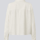 Shirt in a light EcoVero viscose with a loose fit. HudgesMD shirt has a collar, button closure in front, and long sleeves with cuff. 