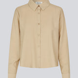 Shirt in beige in a light EcoVero viscose with a loose fit. HudgesMD shirt has a collar, button closure in front, and long sleeves with cuff.&nbsp;