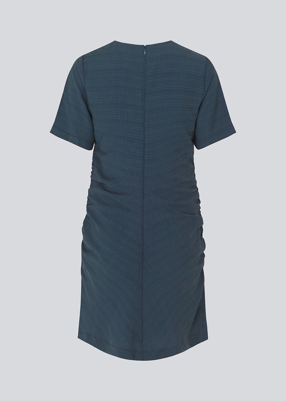 Fitted mini dress in dark navy with an elastic gathering in the side. IbiMD dress has an invisible zipper in the back.