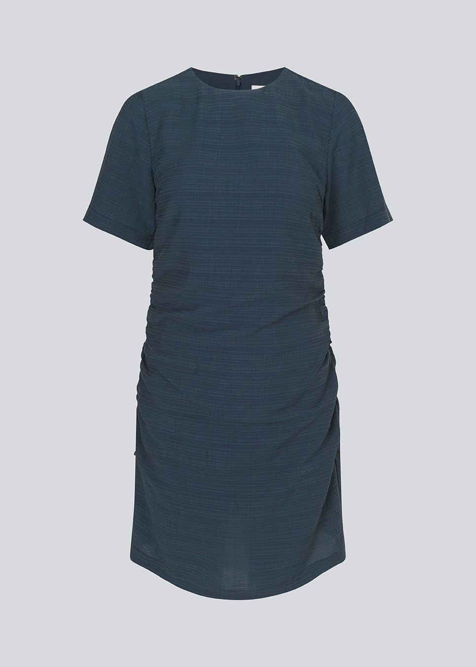 Fitted mini dress in dark navy with an elastic gathering in the side. IbiMD dress has an invisible zipper in the back.