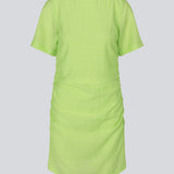 Fitted mini dress in green with an elastic gathering on the side. IbiMD dress has an invisible zipper in the back.