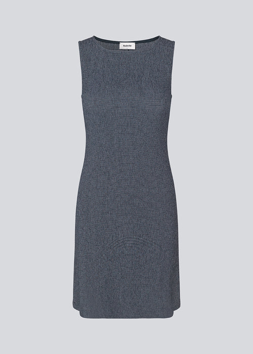 Sleeveless dress in an elastic structured material. IbsenMD dress has an a-facon and a round neckline. Slightly see-through.&nbsp;&nbsp;