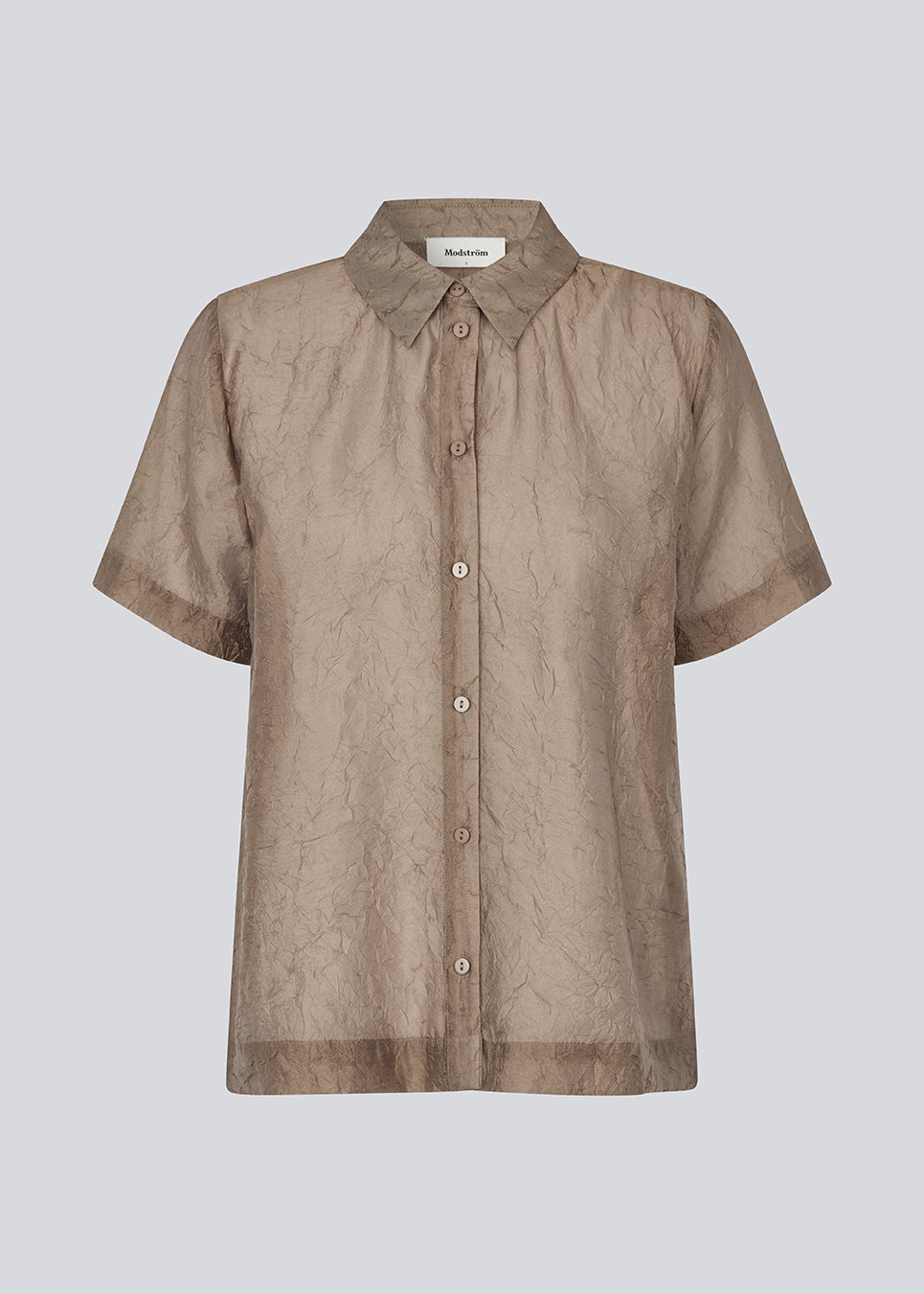 Loose shirt in light brown in a slightly transparent and structured material. IdrisMD shirt has short sleeves and a slit in the sides.