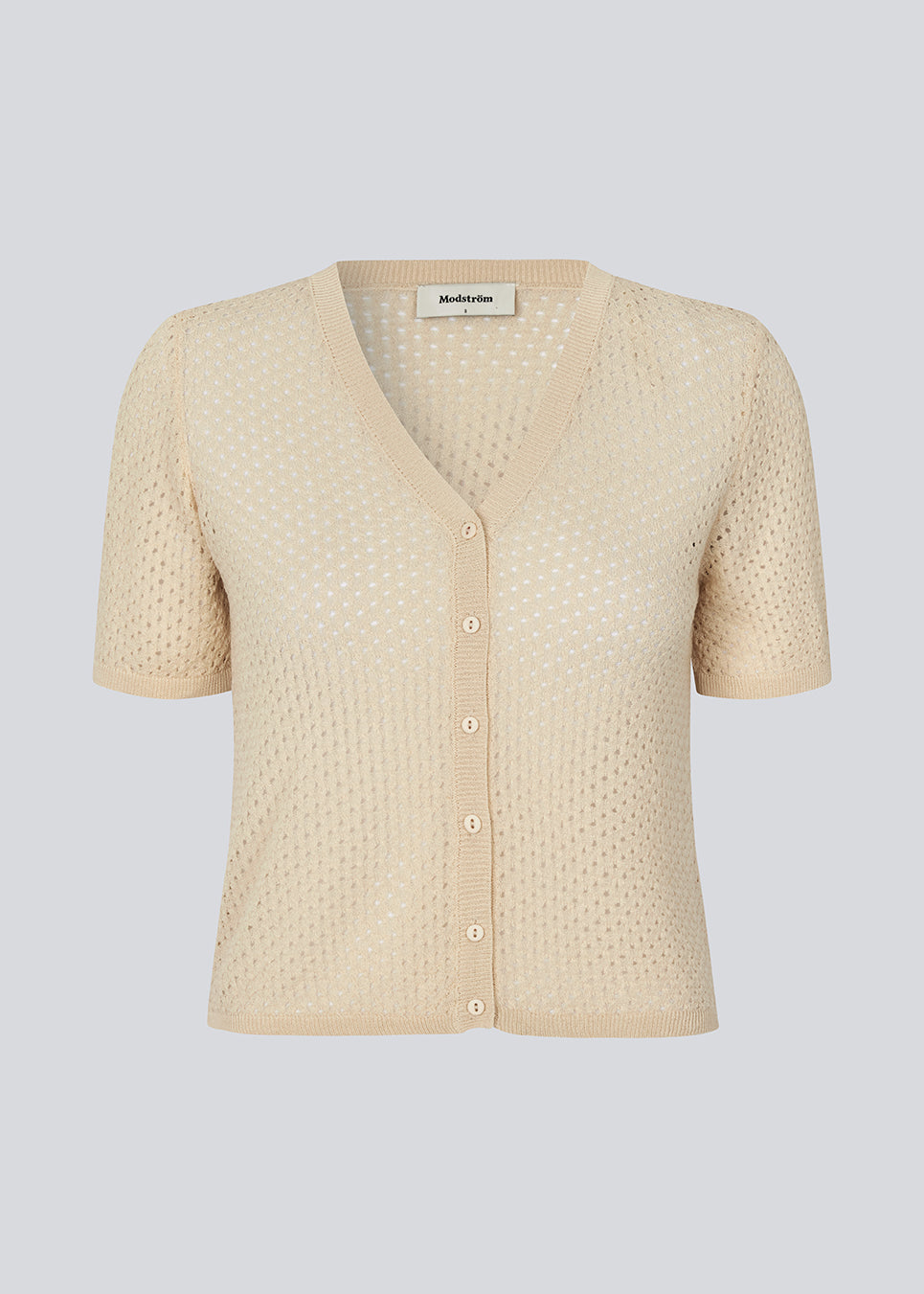 Knitted short-sleeved cardigan in beige in a loose fit. IggyMD cardigan is in slightly see-through and has a V-neckline and rib knit on the hem.