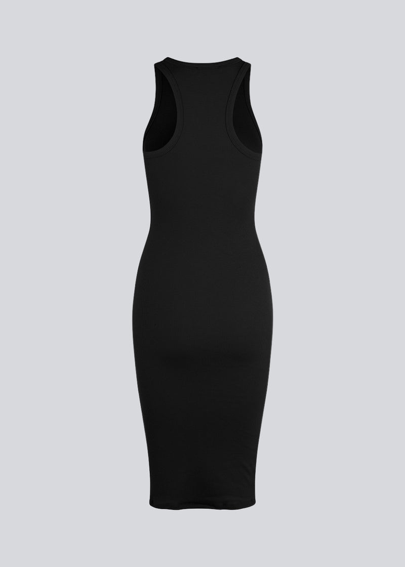 Basic dress in a soft ribbed cotton fabric. IgorMD dress in Black is a slim-fitted style with racer back. Perfect to style for a sporty and relaxed look. The model is 173 cm and wears a size S/36