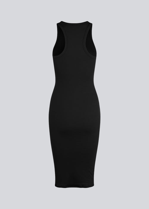 Basic dress in a soft ribbed cotton fabric. IgorMD dress in Black is a slim-fitted style with racer back. Perfect to style for a sporty and relaxed look. The model is 173 cm and wears a size S/36