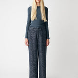 Soft, fitted long-sleeved T-shirt, made from organic cotton rib with stretch and finished with a round neckline. Layer it beneath tailoring or wear it with wide-leg trousers.
 