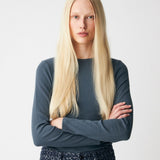 Soft, fitted long-sleeved T-shirt, made from organic cotton rib with stretch and finished with a round neckline. Layer it beneath tailoring or wear it with wide-leg trousers.
 