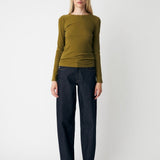 Soft, fitted long-sleeved T-shirt, made from organic cotton rib with stretch and finished with a round neckline. Layer it beneath tailoring or wear it with wide-leg trousers.
 