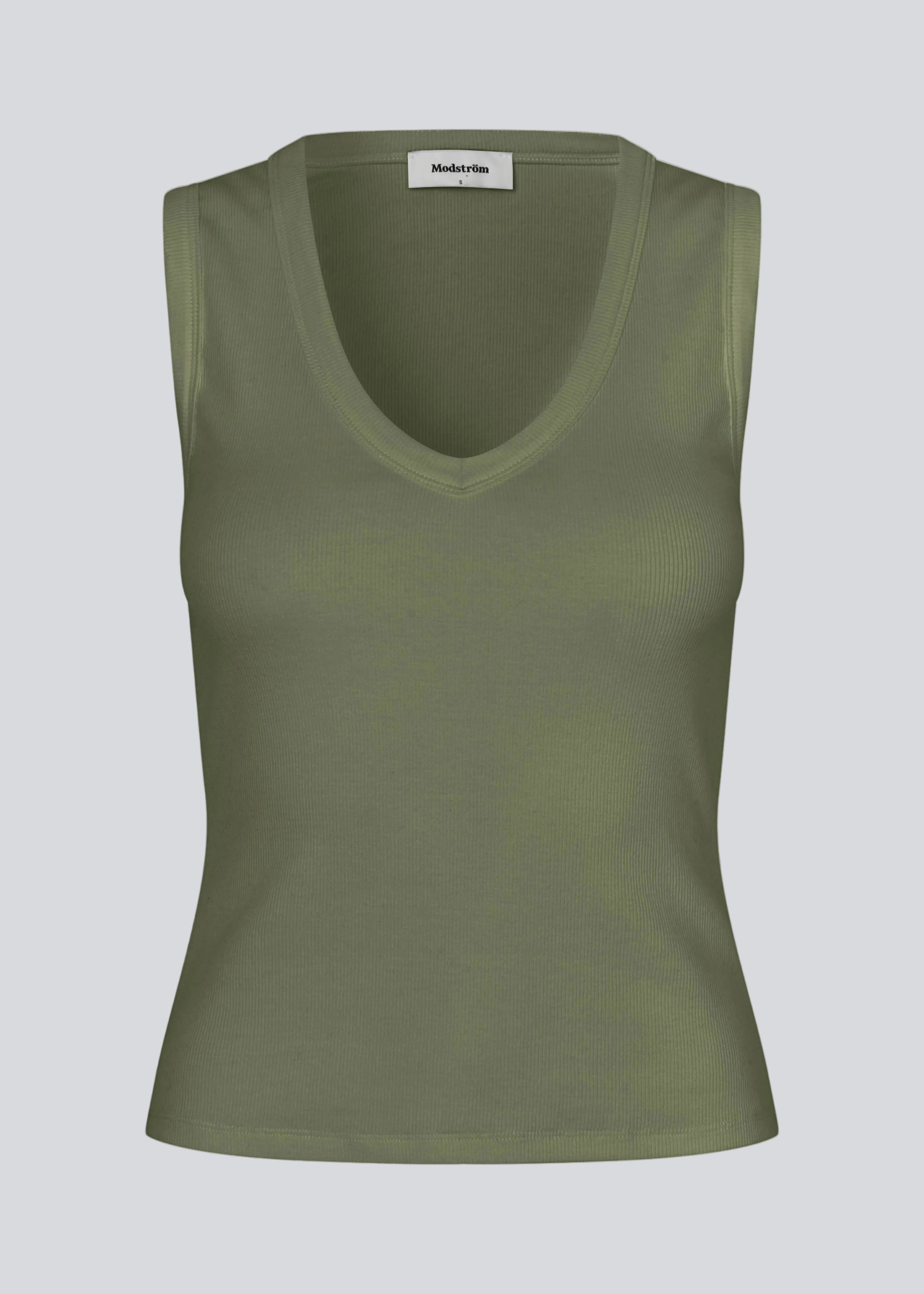 Sleeveless green top in ribbed cotton jersey. Igormd tank top has a tight fit and a round neckline. fit with long sleeves.