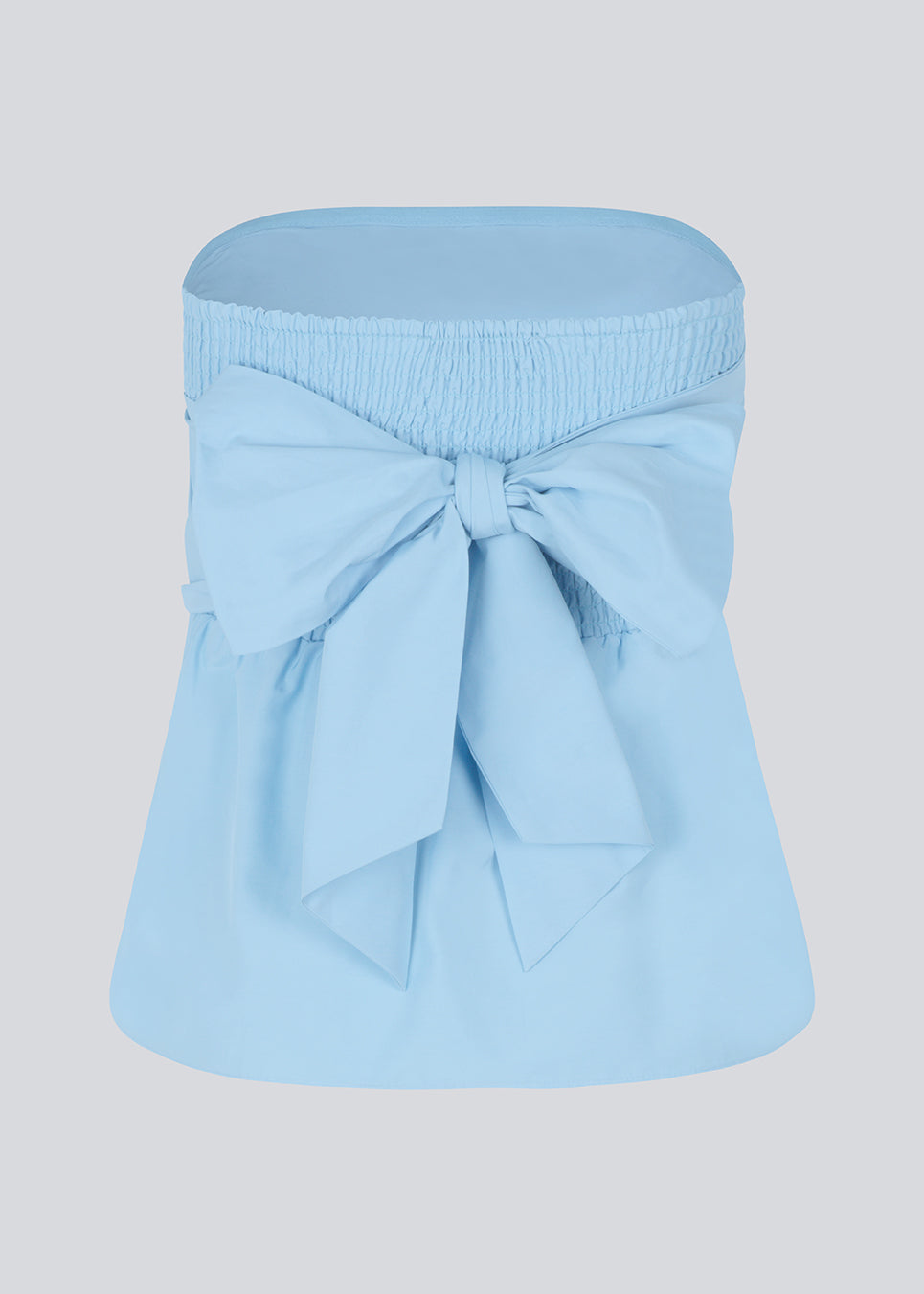 Bandeau top in cute baby blue with a tie band detail and a smock sewed back. IlenaMD has a tight fit at the top with a peplum effect. Tie the bow in the back or the front.