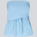 Bandeau top in cute baby blue with a tie band detail and a smock sewed back. IlenaMD has a tight fit at the top with a peplum effect. Tie the bow in the back or the front.