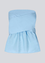 Bandeau top in cute baby blue with a tie band detail and a smock sewed back. IlenaMD has a tight fit at the top with a peplum effect. Tie the bow in the back or the front.