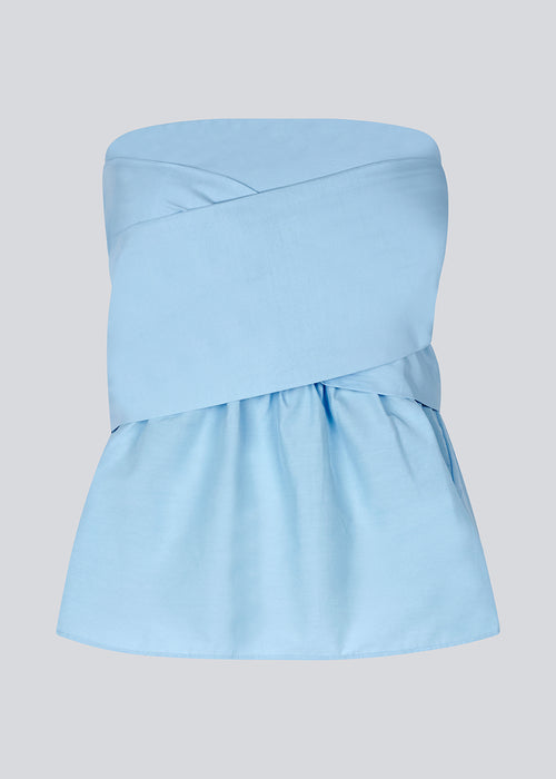 Bandeau top in cute baby blue with a tie band detail and a smock sewed back. IlenaMD has a tight fit at the top with a peplum effect. Tie the bow in the back or the front.