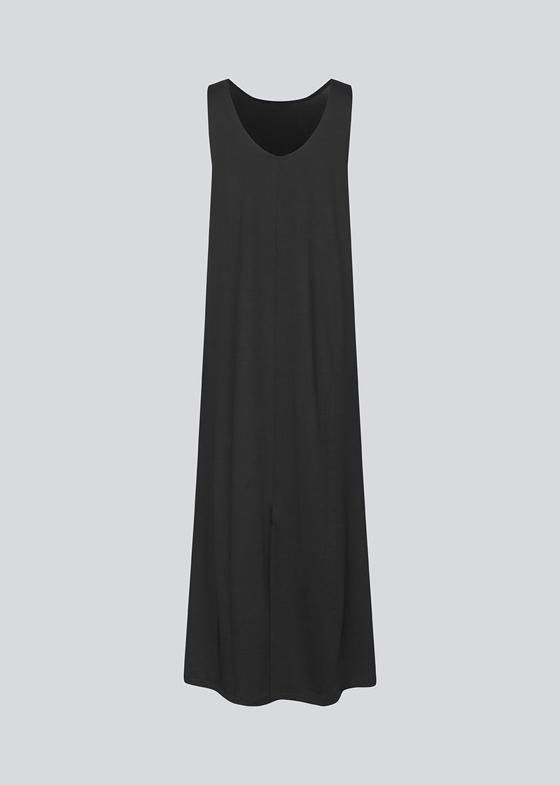 Long sleeveless dress with a loose fit. ImaMD dress has a wide neckline and a deeper back cut.