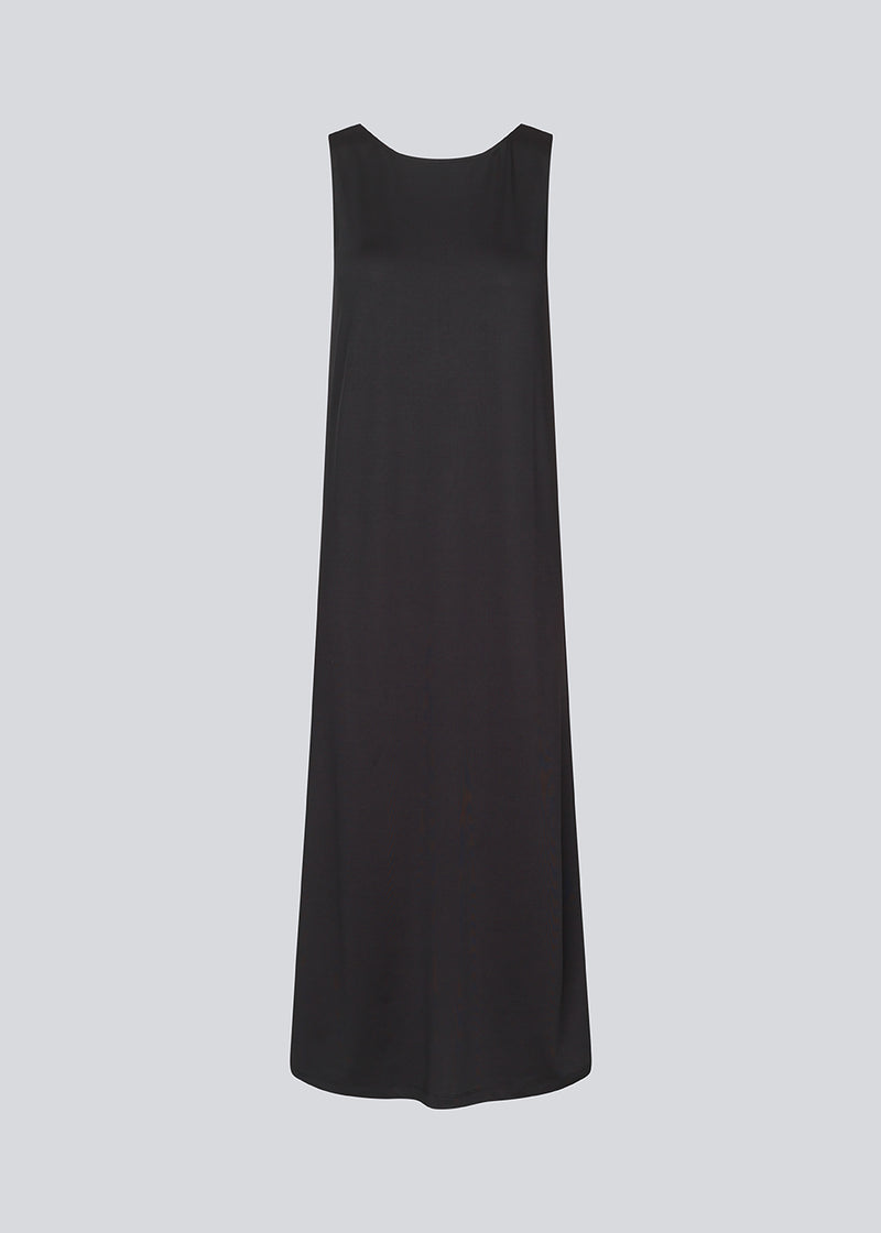 Long sleeveless dress with a loose fit. ImaMD dress has a wide neckline and a deeper back cut.