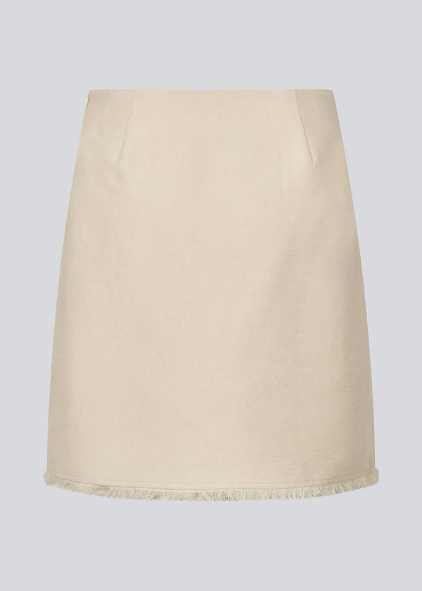 Short skirt in a linen blend. IngridMD skirt has an invisible zipper and raw edges at the front and bottom. Style with matching jacket: IngridMD jacket.