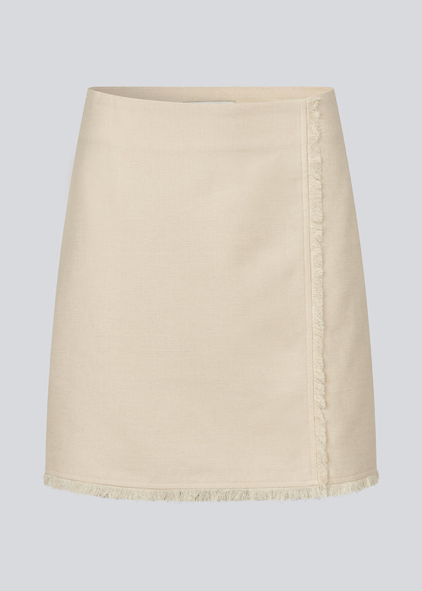 Short skirt in a linen blend. IngridMD skirt has an invisible zipper and raw edges at the front and bottom. Style with matching jacket: IngridMD jacket.