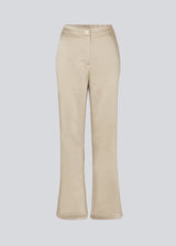 Flared pants in satin with an elastic in the back. IolaMD pants have a high waist, side pockets and a paspoli back pocket.