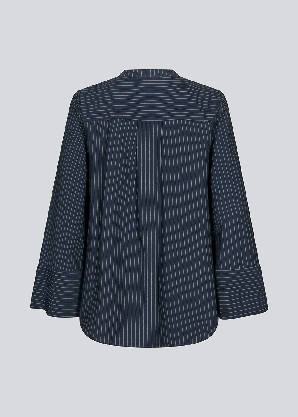 Navy shirt with copped sleeves and a slit. IsabelMD shirt has a hidden button closure and a high neck.