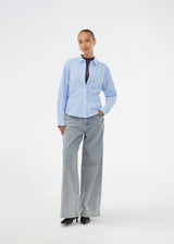 Jeans with wide legs in cotton denim in a light blue wash. IsoldeMD pants have a high waist, front and back pockets and a tie band at the waist.