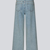 Jeans with wide legs in cotton denim in a light blue wash. IsoldeMD pants have a high waist, front and back pockets and a tie band at the waist.
